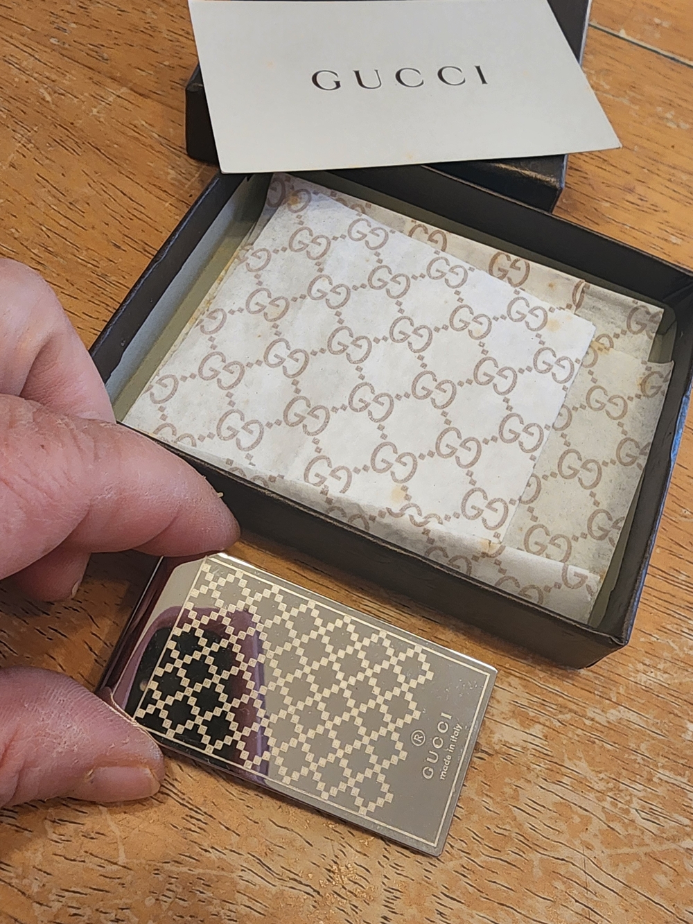 Gucci Diamante money clip featuring the signature diamond pattern and engraved